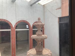 Patio con fuente de CANTERA ROSA